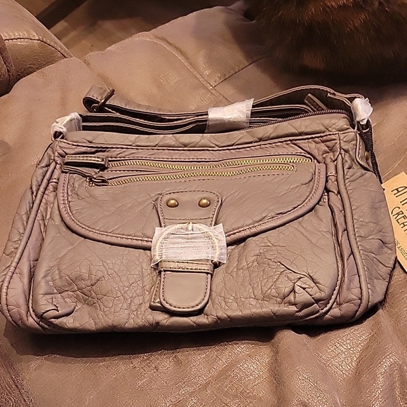 Gray Crossbody Bag with Adjustable Strap and Textured Material - Picture 1 of 6